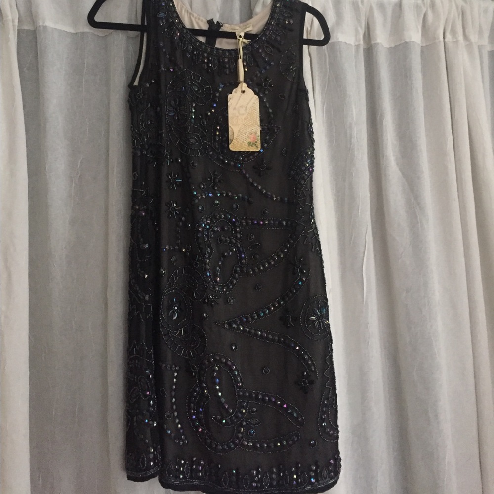 NWT frock and frill beaded Dress. Tag says 10 but fits like US size 4